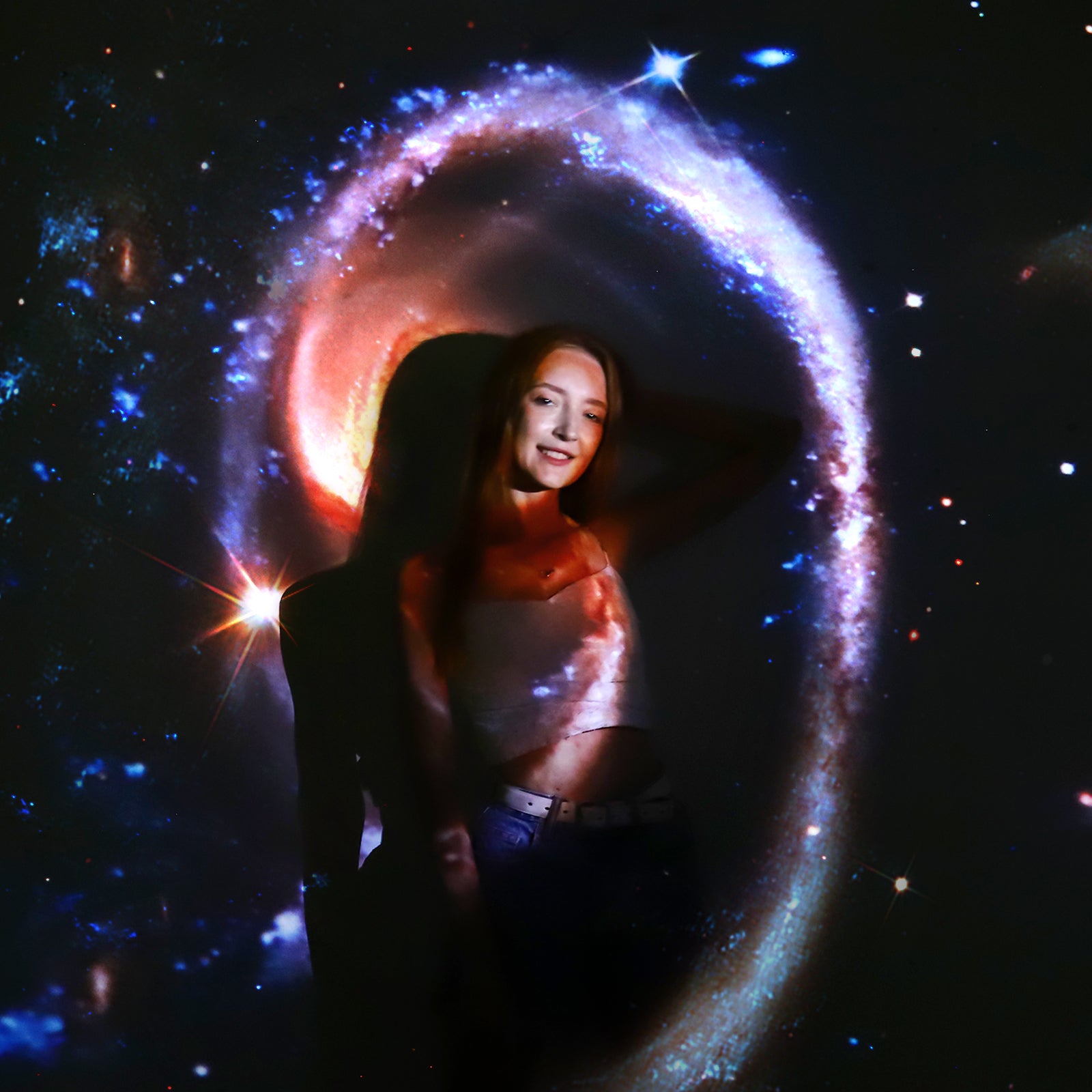Woman standing under the projection of POCOCO Galaxy projector